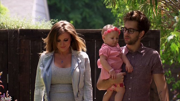 Family man: The singer, pictured with his wife and daughter, chose Adam as his coach